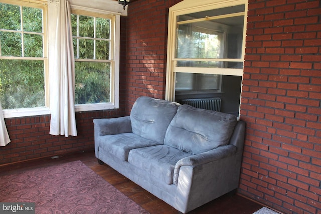 sunroom / solarium featuring radiator