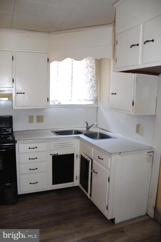 kitchen featuring black range with electric stovetop, sink, dark hardwood / wood-style floors, range hood, and white cabinetry