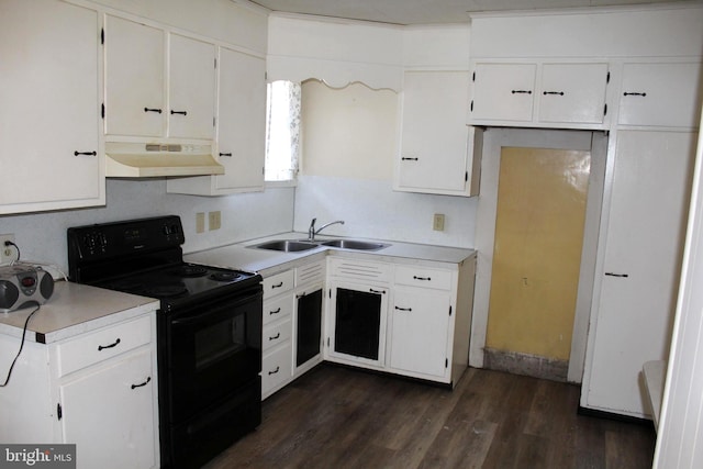 kitchen featuring dark hardwood / wood-style flooring, black range with electric cooktop, white cabinetry, and sink