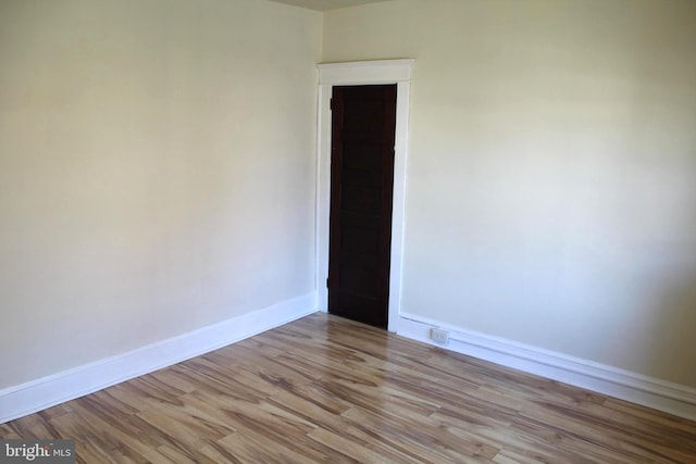 spare room featuring light wood-type flooring