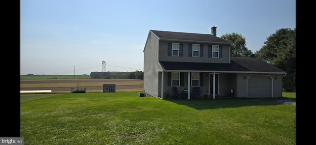 view of front of property featuring a garage and a front lawn