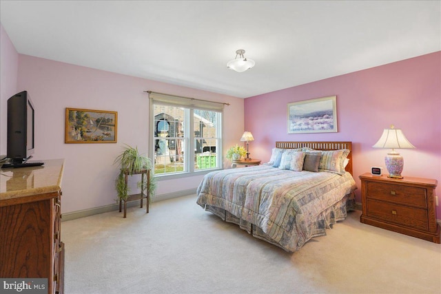 bedroom featuring light colored carpet