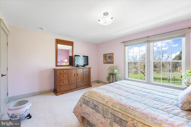 bedroom featuring light carpet