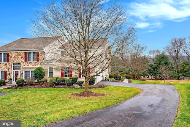 view of front of home with a front lawn