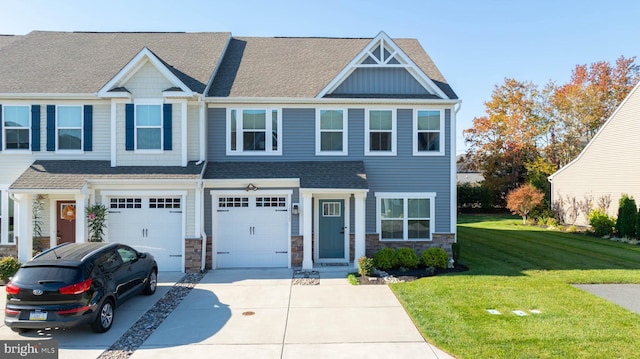 view of front of home featuring a garage and a front yard