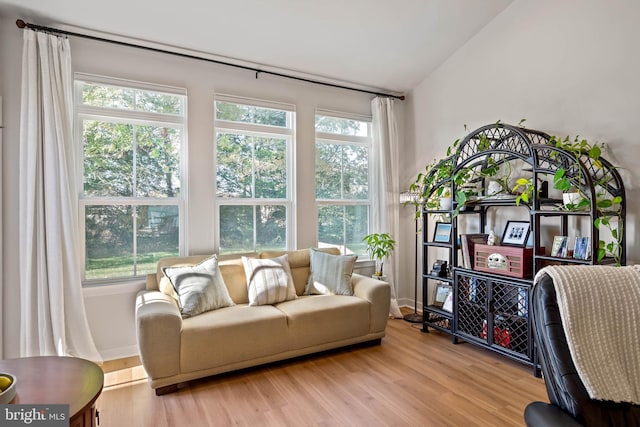 sunroom / solarium with vaulted ceiling and a healthy amount of sunlight