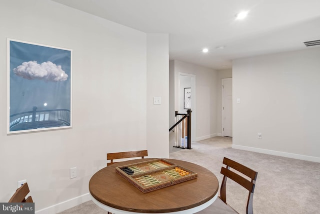 dining area with light colored carpet