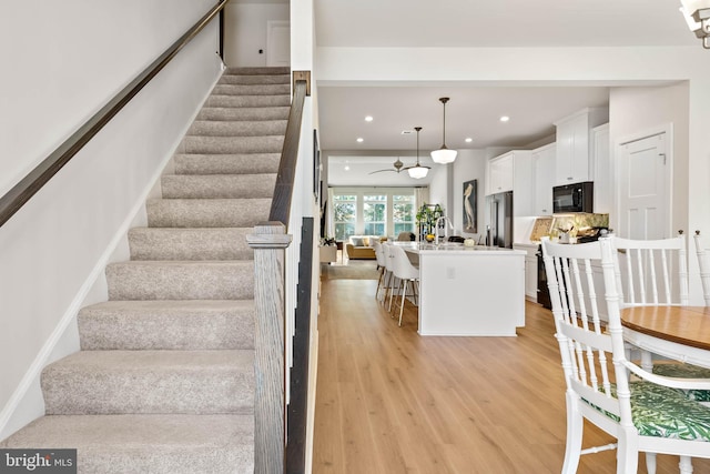 stairway with wood-type flooring