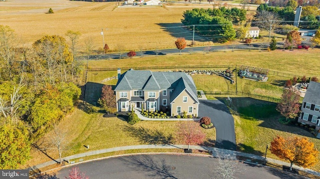 birds eye view of property featuring a rural view