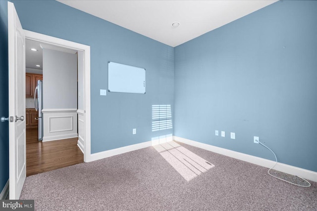 empty room featuring carpet flooring