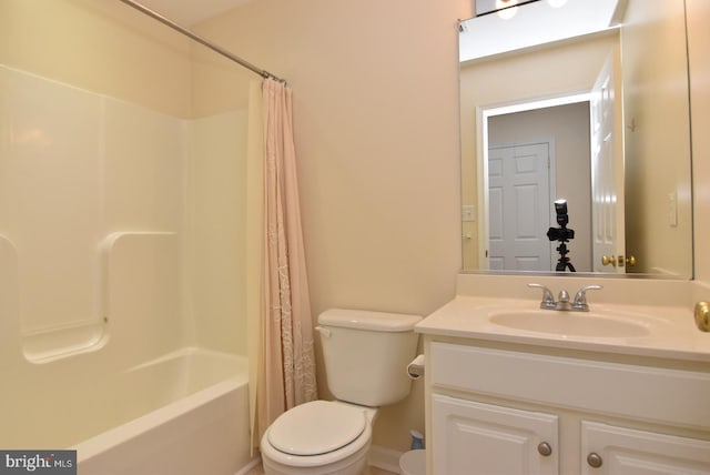 full bathroom with toilet, shower / bath combo with shower curtain, and vanity