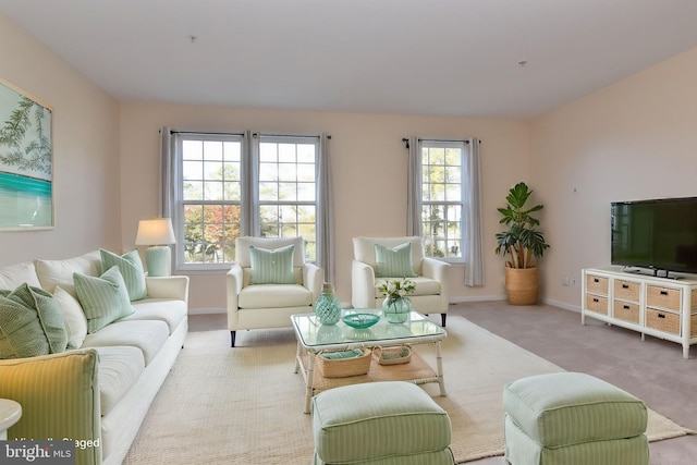 living room featuring light carpet and plenty of natural light