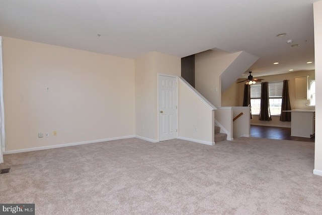 carpeted empty room with ceiling fan