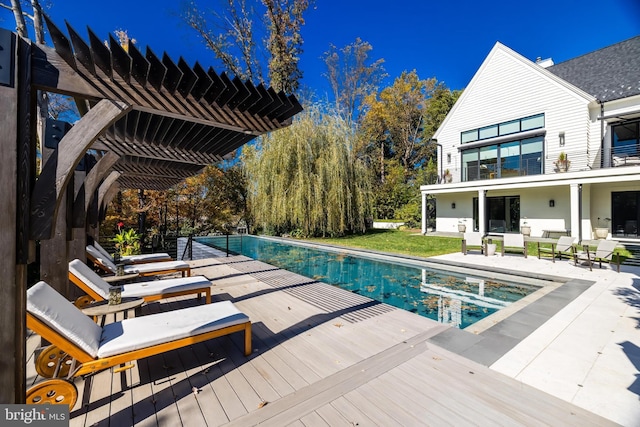 view of swimming pool featuring an outdoor hangout area, a pergola, and a wooden deck