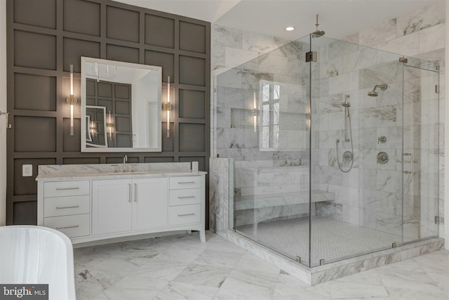 bathroom with shower with separate bathtub and vanity