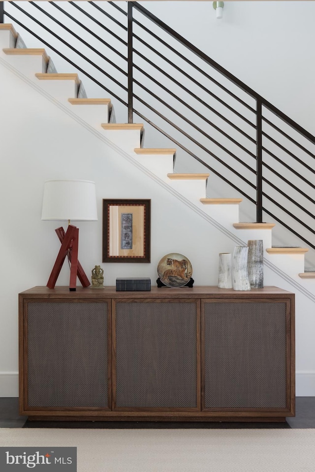 stairway featuring a high ceiling