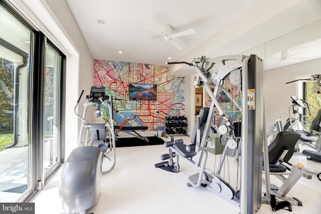 interior space with ceiling fan