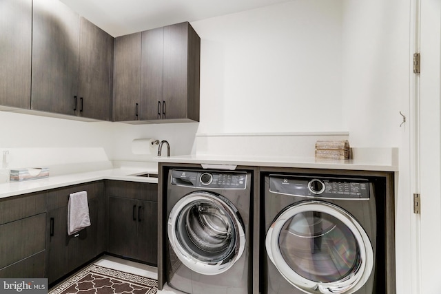 laundry room with separate washer and dryer, cabinets, sink, and light tile patterned floors