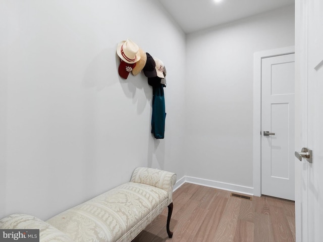 mudroom with light hardwood / wood-style flooring