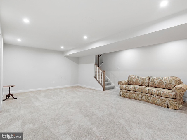 basement featuring light carpet