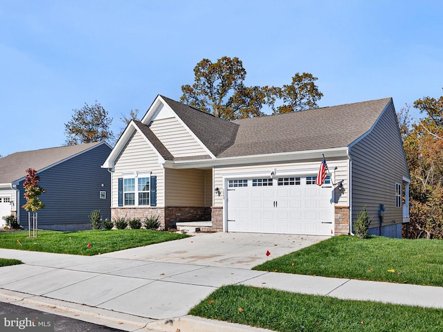 view of front of home featuring a garage and a front lawn