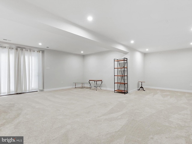 empty room featuring light colored carpet