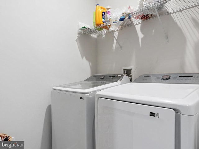 washroom featuring separate washer and dryer