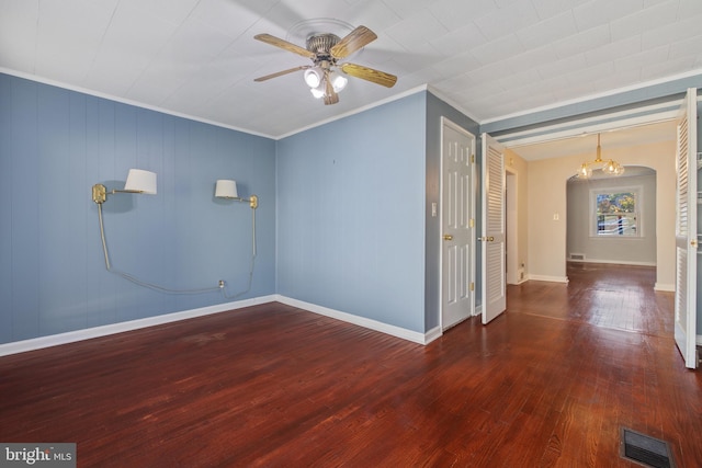 spare room featuring baseboards, visible vents, ceiling fan, and wood-type flooring
