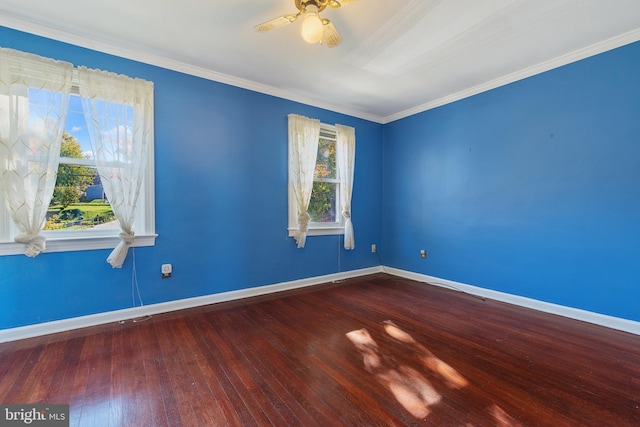 unfurnished room with ornamental molding, a ceiling fan, hardwood / wood-style flooring, and baseboards