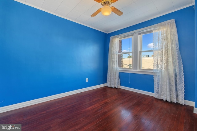 spare room with hardwood / wood-style floors, ornamental molding, a ceiling fan, and baseboards