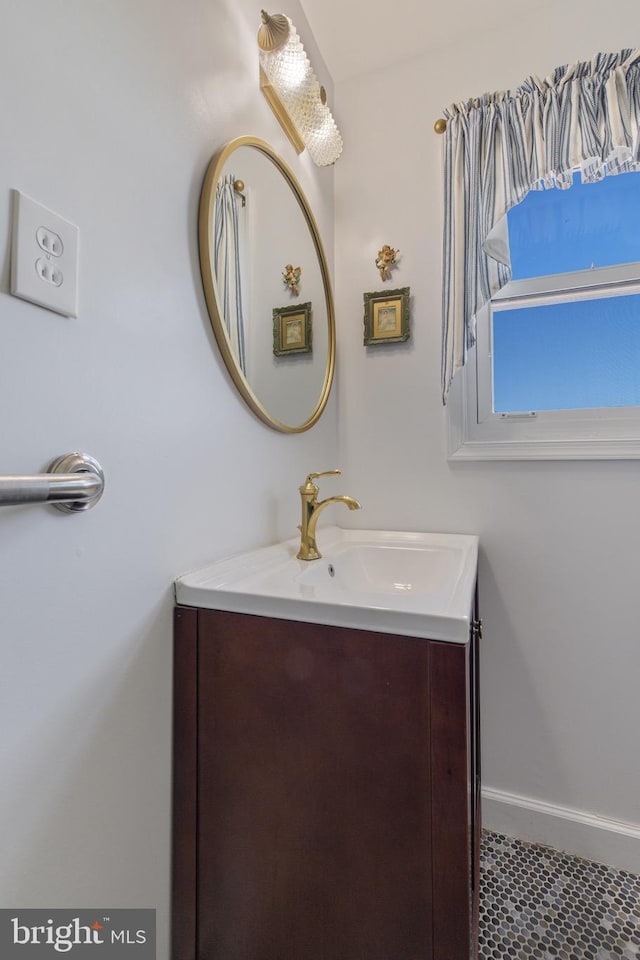 bathroom featuring vanity and baseboards