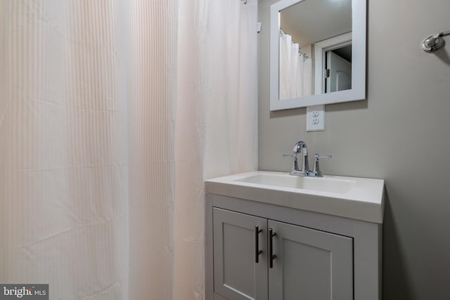 bathroom with vanity and a shower with curtain