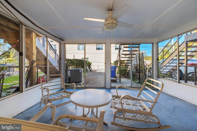 sunroom / solarium featuring ceiling fan and a wealth of natural light