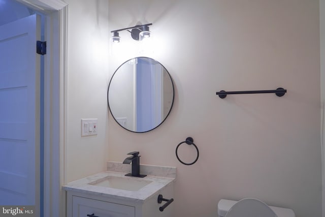 bathroom with vanity and toilet