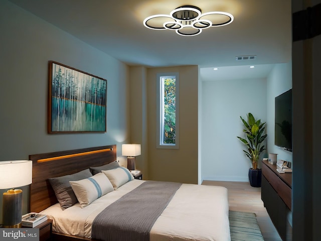 bedroom featuring light hardwood / wood-style floors