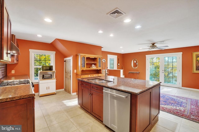 kitchen with dishwasher, sink, a center island with sink, and plenty of natural light