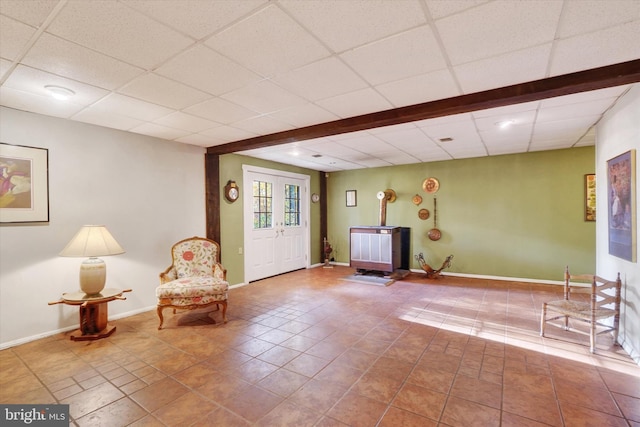 unfurnished room featuring tile patterned floors and a paneled ceiling