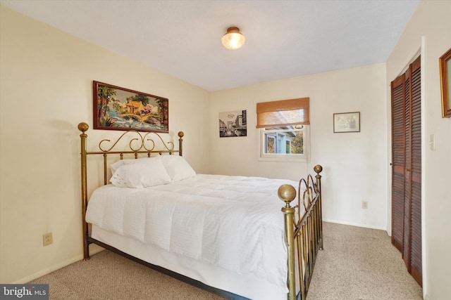 carpeted bedroom featuring a closet