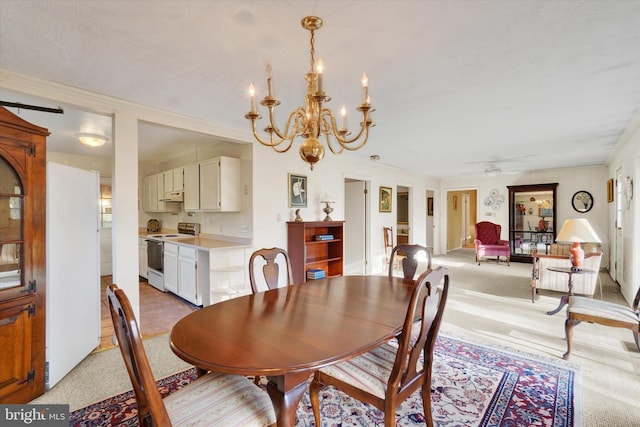 dining area with light carpet and ceiling fan with notable chandelier