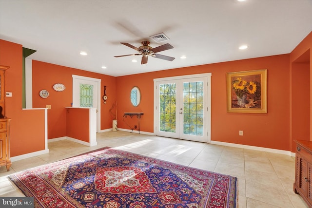 interior space with french doors and ceiling fan