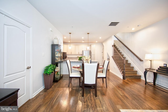 dining room with dark hardwood / wood-style floors