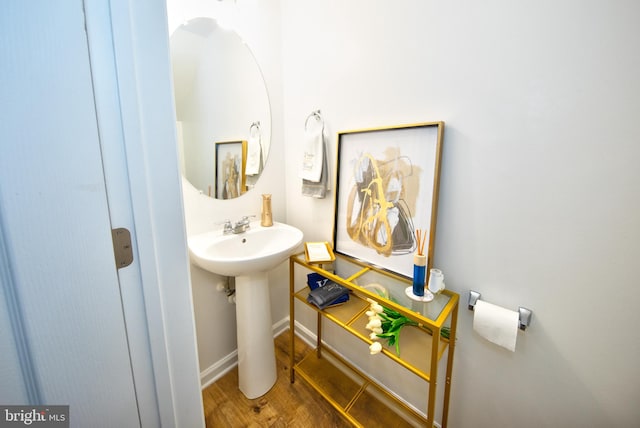 bathroom with sink and hardwood / wood-style flooring