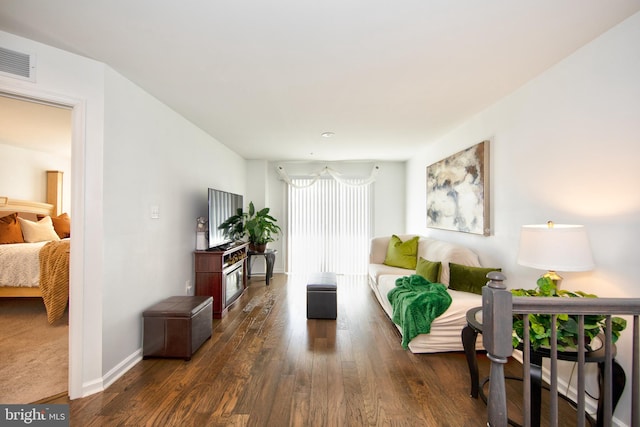 living room featuring dark hardwood / wood-style flooring