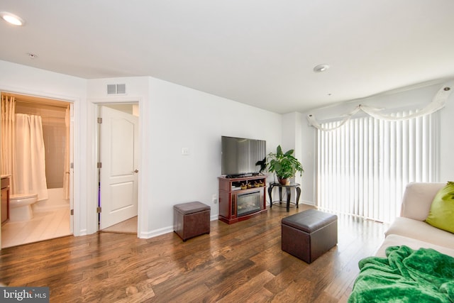 living room featuring dark wood-type flooring