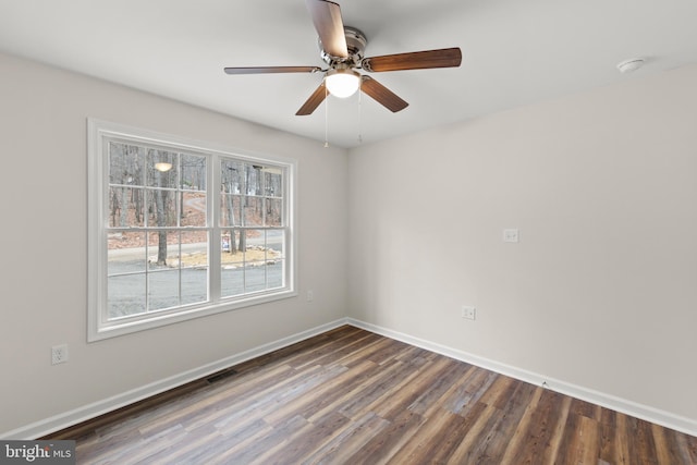 unfurnished room with ceiling fan and dark hardwood / wood-style floors