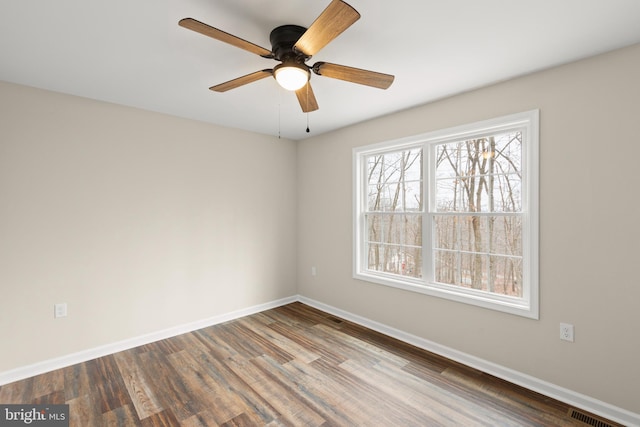 empty room featuring hardwood / wood-style floors and ceiling fan