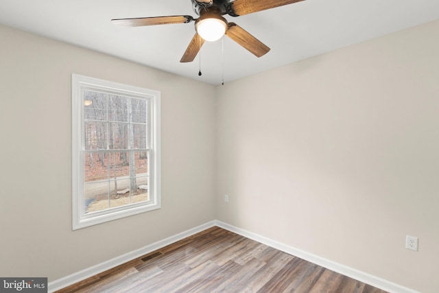 unfurnished room with ceiling fan and wood-type flooring