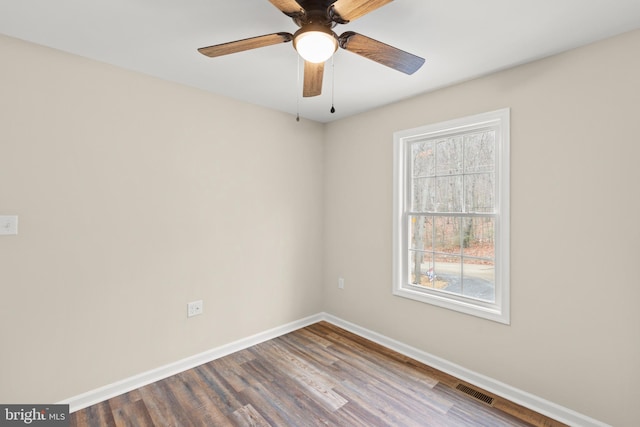 empty room featuring hardwood / wood-style floors and ceiling fan