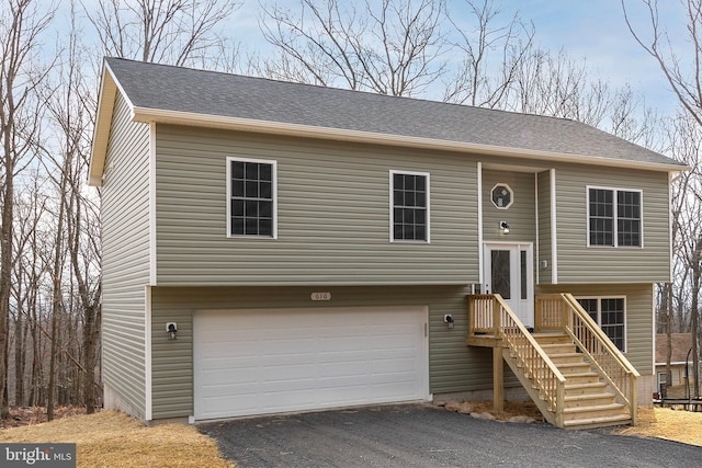 split foyer home featuring a garage