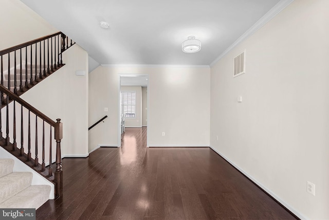 interior space featuring crown molding and dark hardwood / wood-style floors